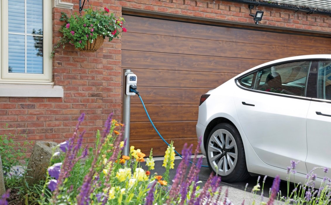 Fast Amps A7 charger at home with EV parked on drive